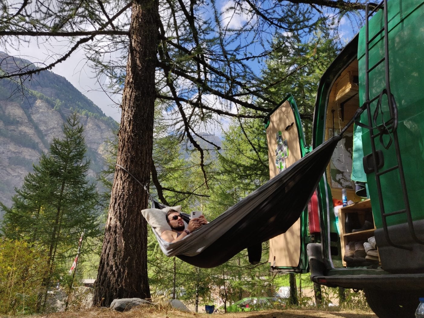 Renault-Master-2-van-campervan-wood-camping-selfmade-exterior-hammock-relax-vanlife