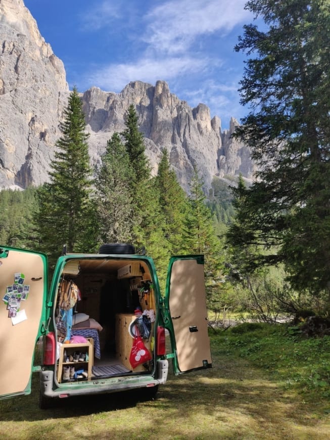 Renault-Master-2-van-campervan-wood-camping-selfmade-exterior-mountains-open-door-vanlife